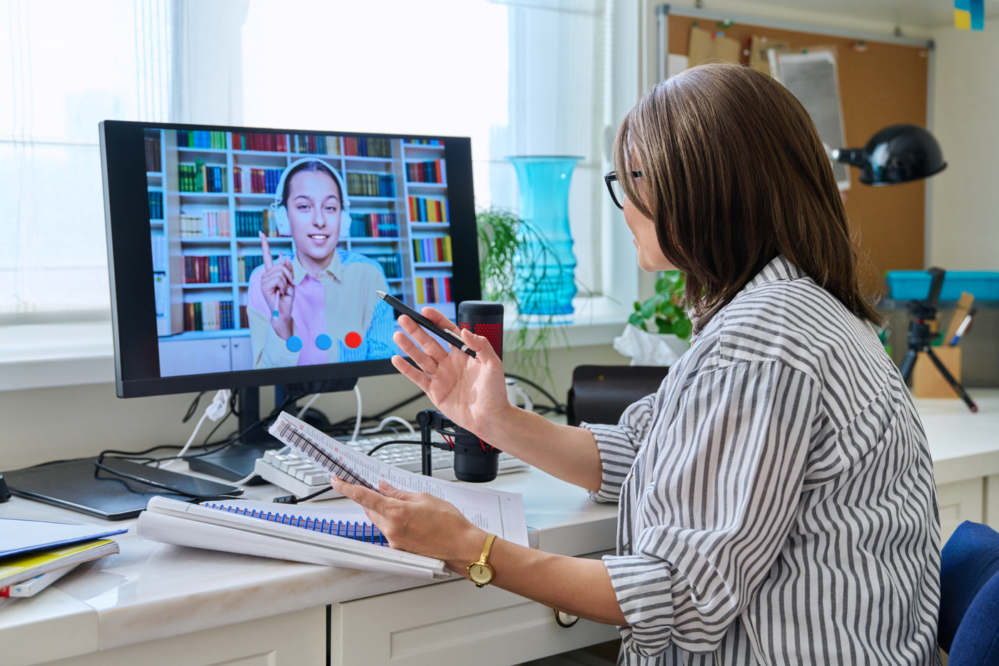 Mature Woman Talking Online with Teenage Girl Using Video Call